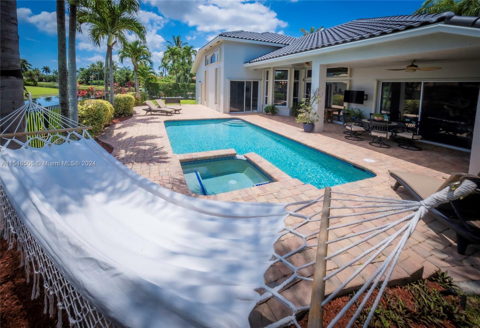 10849-10849 Bal Harbor Drive Boca Raton, FL 33498 - Photo 29 of 72 a view of a house with backyard and sitting area
