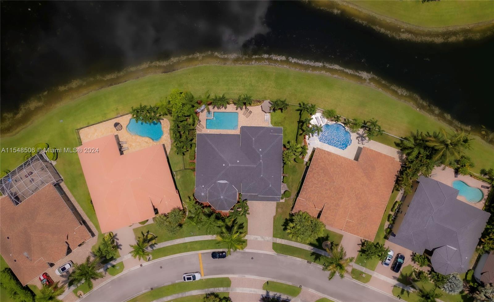 10849-10849 Bal Harbor Drive Boca Raton, FL 33498 - Photo 32 of 72 an aerial view of a house with outdoor space and a lake view