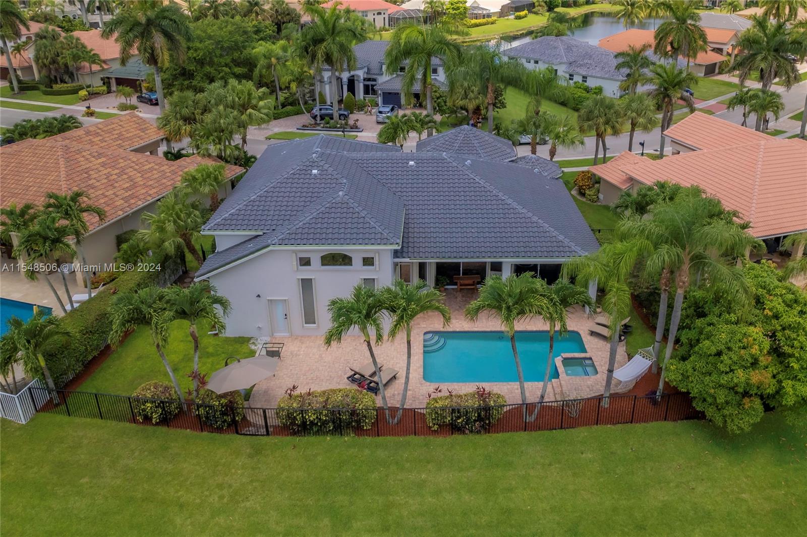 10849-10849 Bal Harbor Drive Boca Raton, FL 33498 - Photo 34 of 72 an aerial view of a house with a garden and swimming pool