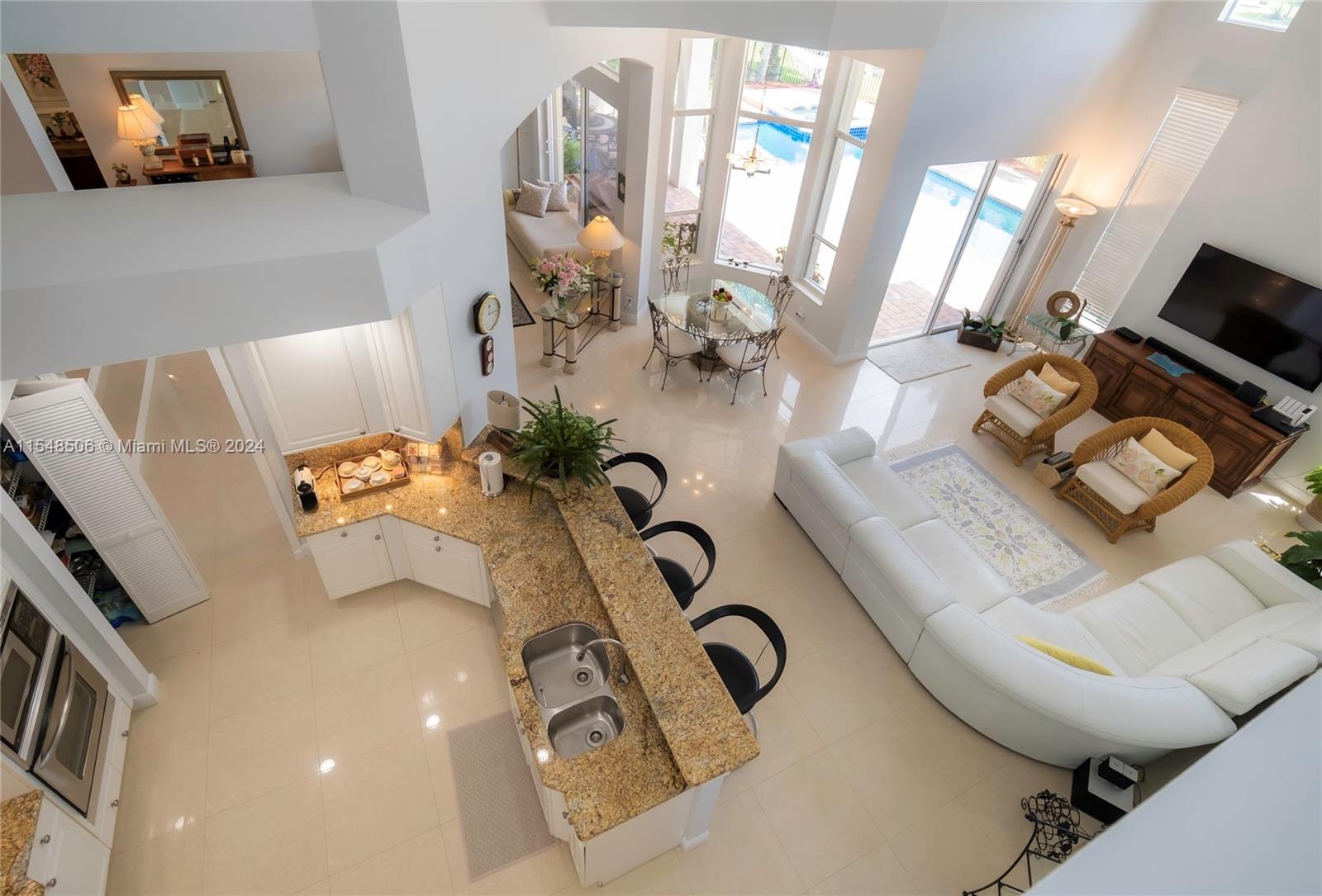 10849-10849 Bal Harbor Drive Boca Raton, FL 33498 - Photo 36 of 72 a bathroom with a sink mirror and vanity