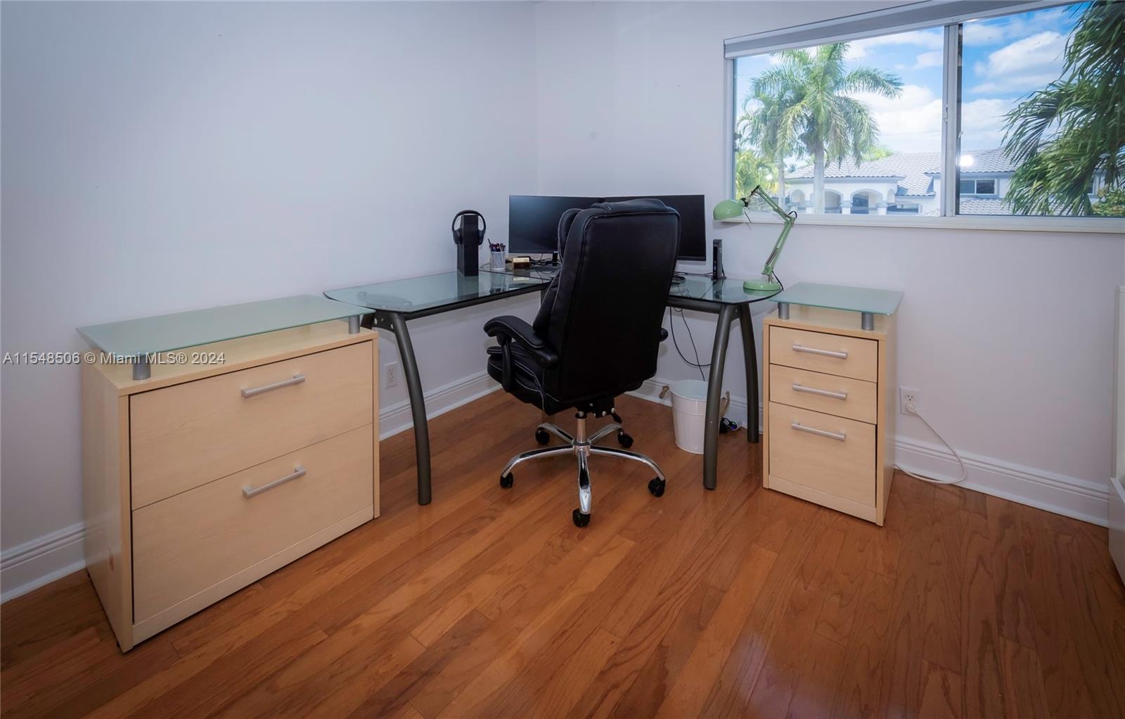 10849-10849 Bal Harbor Drive Boca Raton, FL 33498 - Photo 43 of 72 a view of a workspace with furniture and a window