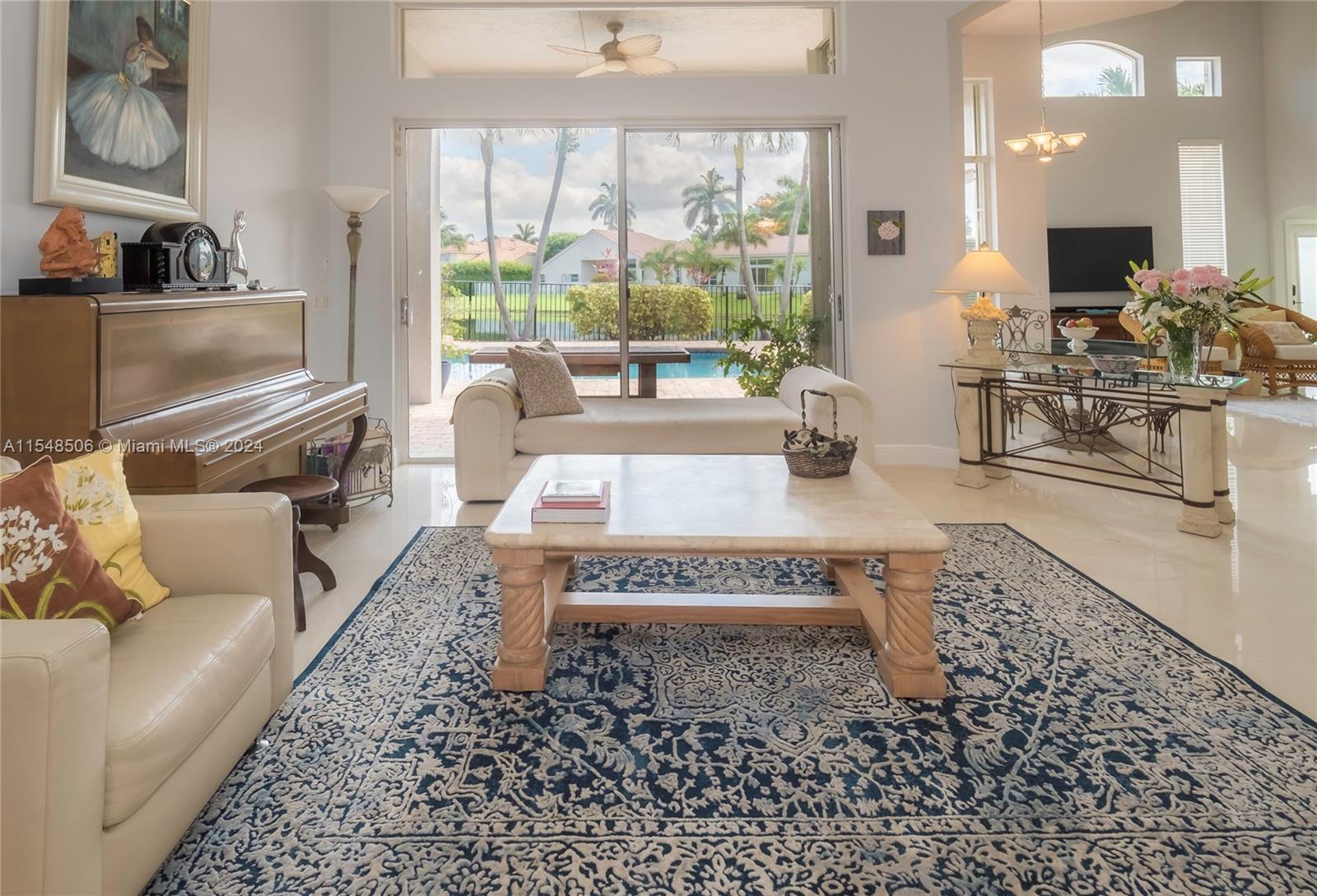 10849-10849 Bal Harbor Drive Boca Raton, FL 33498 - Photo 6 of 72 a living room with furniture and a large window