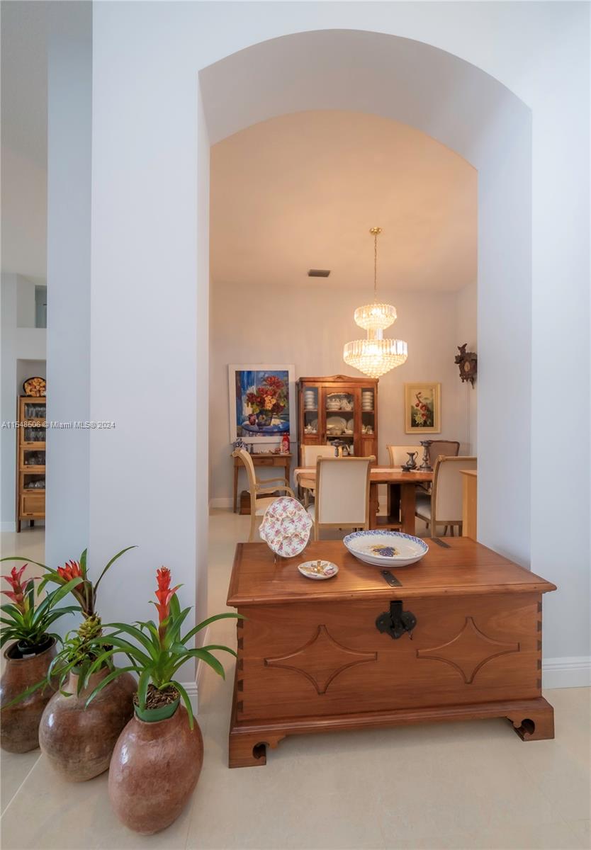 10849-10849 Bal Harbor Drive Boca Raton, FL 33498 - Photo 7 of 72 a dining room with furniture and a potted plant