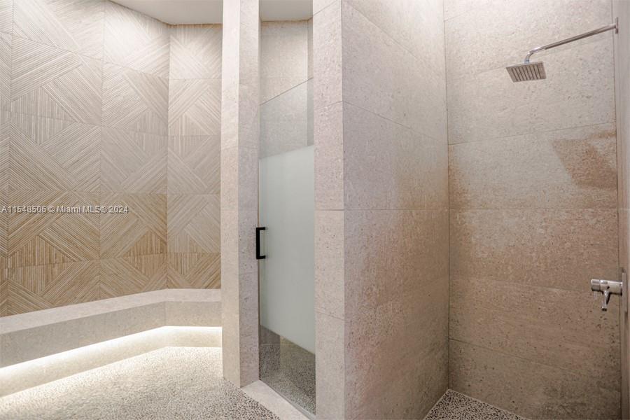 10849-10849 Bal Harbor Drive Boca Raton, FL 33498 - Photo 72 of 72 a bathroom with a bathtub and shower