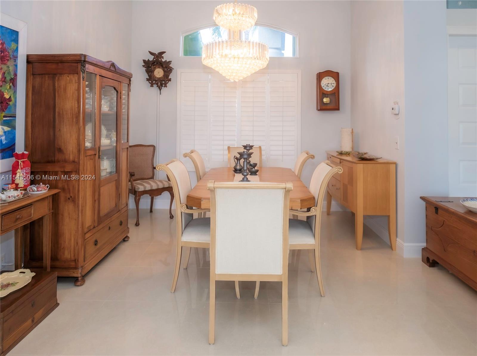 10849-10849 Bal Harbor Drive Boca Raton, FL 33498 - Photo 8 of 72 a dining room with furniture and a chandelier