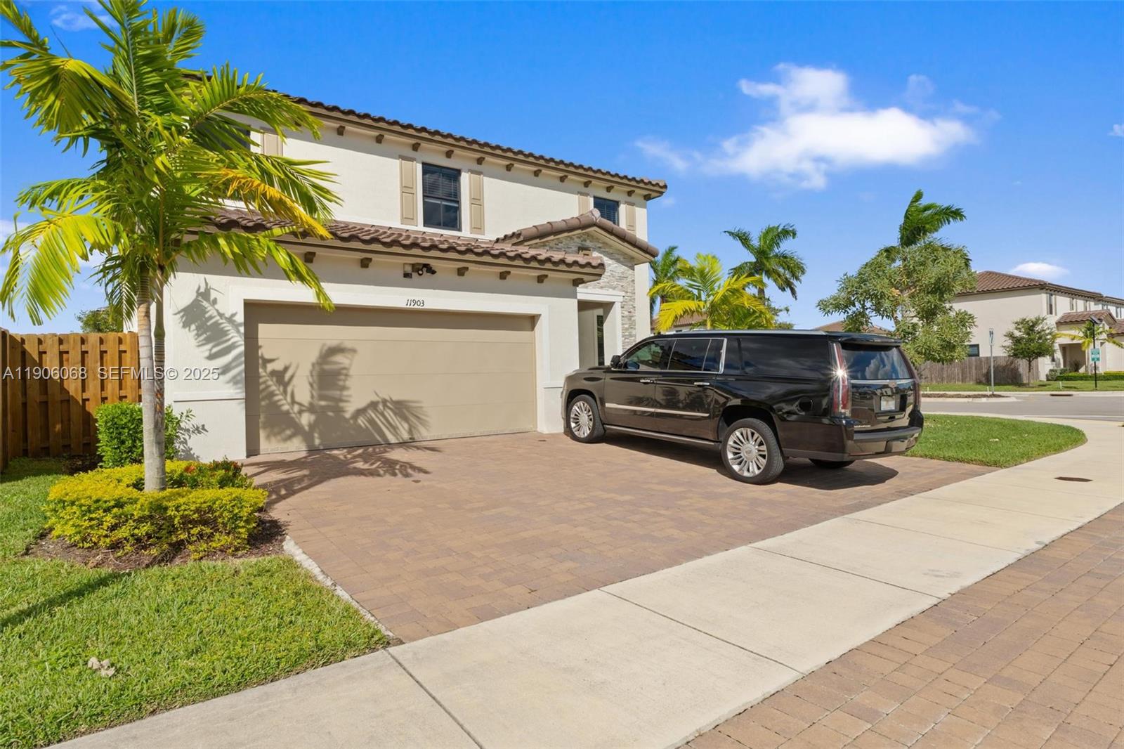 11903 Southwest 241st Street Homestead, FL 33032 - Photo 2 of 56 a car parked in front of a house