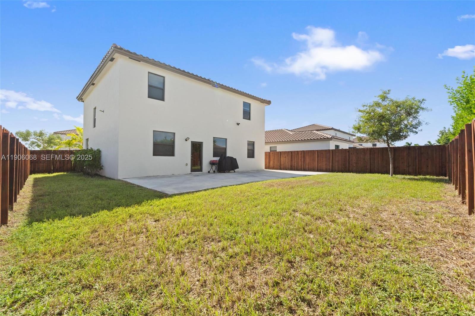 11903 Southwest 241st Street Homestead, FL 33032 - Photo 24 of 56 a front view of a house with garden