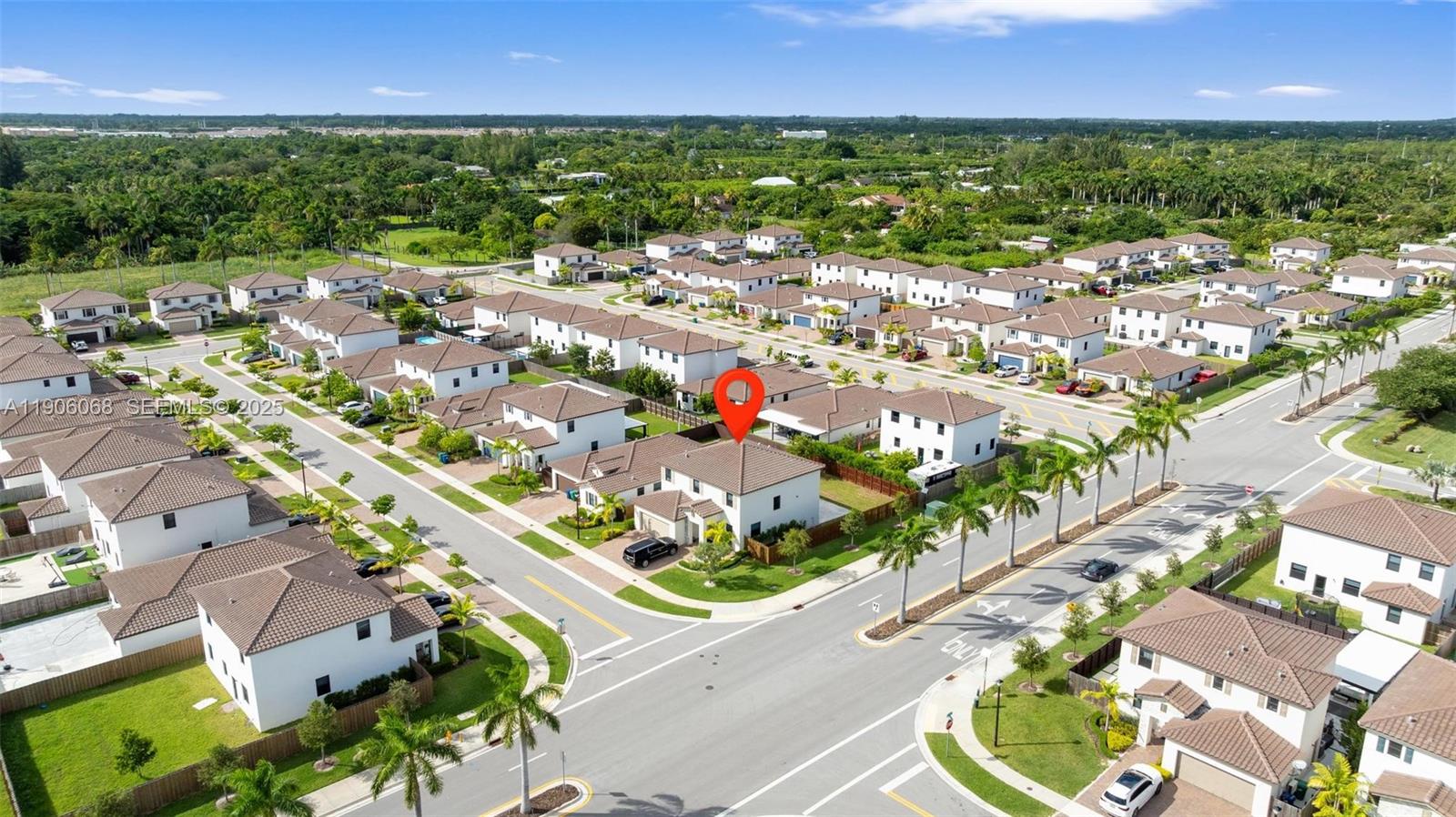 11903 Southwest 241st Street Homestead, FL 33032 - Photo 47 of 56 an aerial view of residential houses with outdoor space and trees