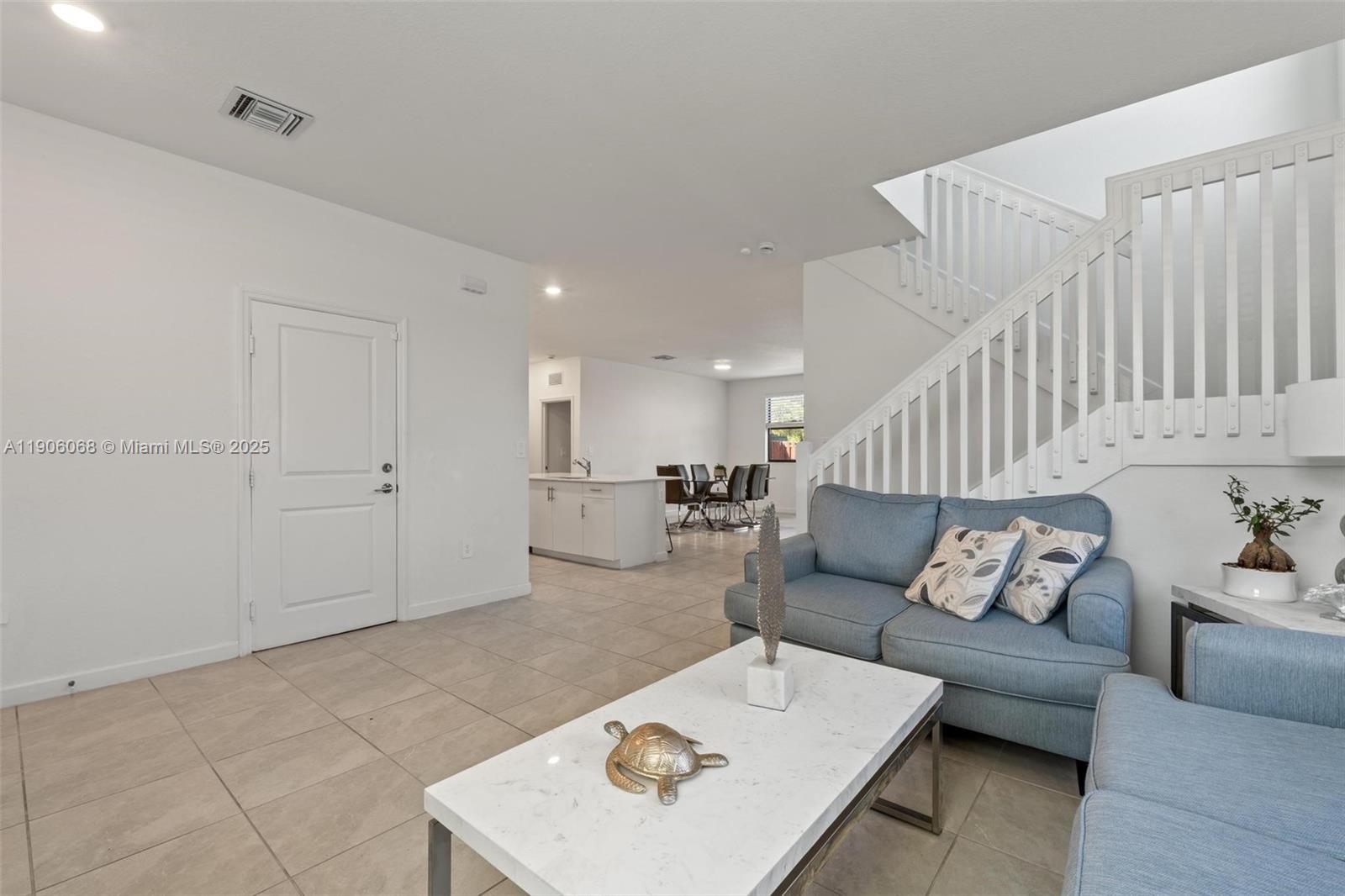 11903 Southwest 241st Street Homestead, FL 33032 - Photo 7 of 56 a living room with furniture and wooden floor
