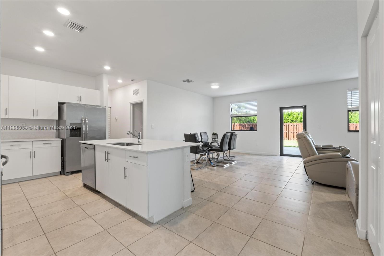 11903 Southwest 241st Street Homestead, FL 33032 - Photo 8 of 56 a kitchen with cabinets and chairs