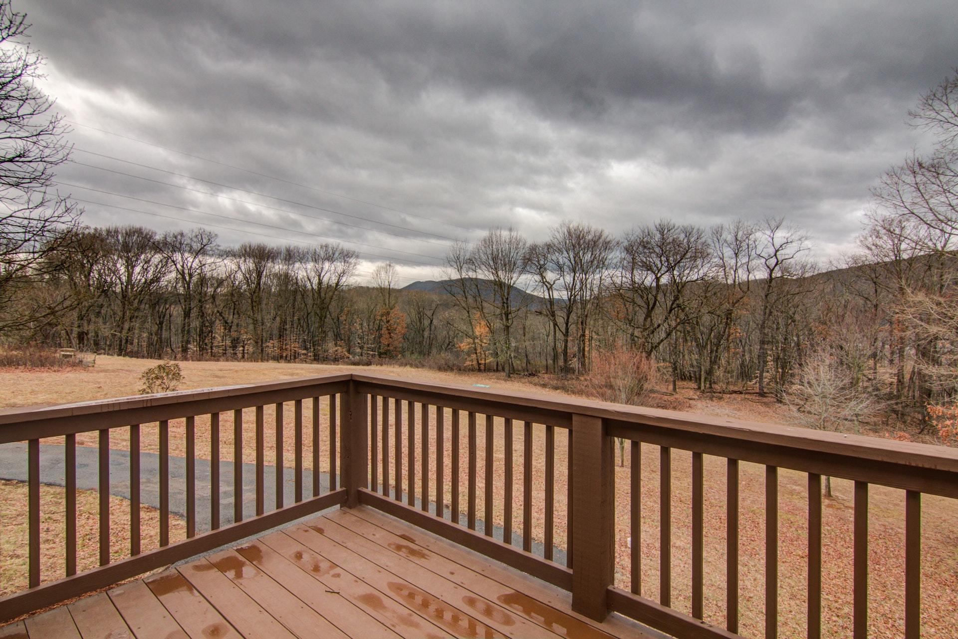 1847 Redwood Road Southeast Roanoke, VA 24014 - Photo 11 of 33 a balcony with wooden floor and fence