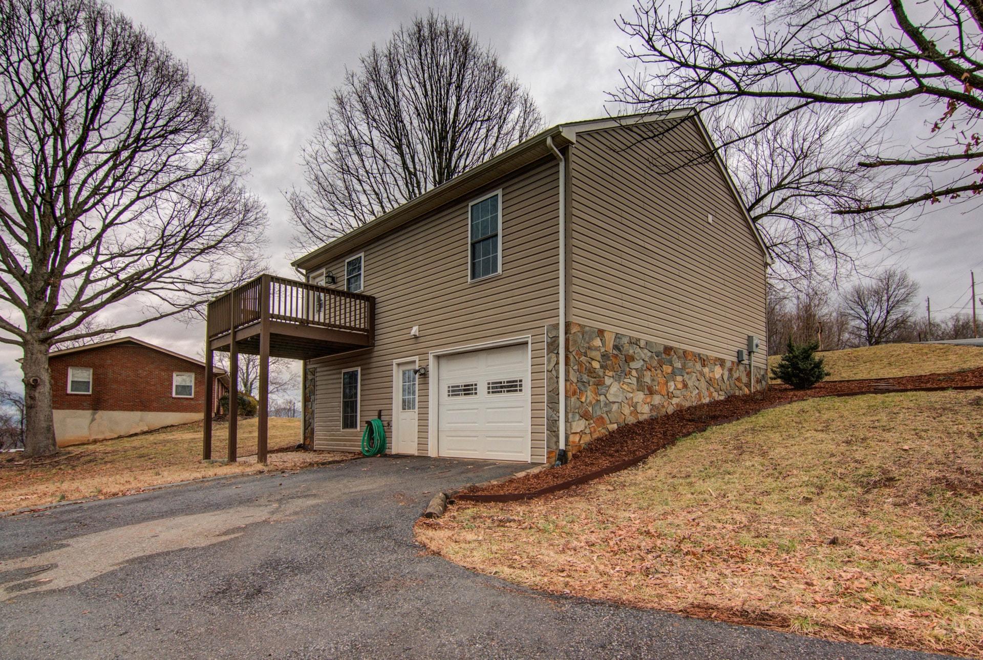 1847 Redwood Road Southeast Roanoke, VA 24014 - Photo 27 of 33 a view of a house with a yard and garage