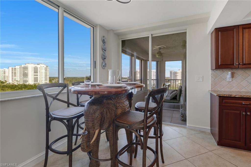 25 Bluebill Avenue, Unit A906 Naples, FL 34108 - Photo 18 of 40 a view of a dining room with furniture and window