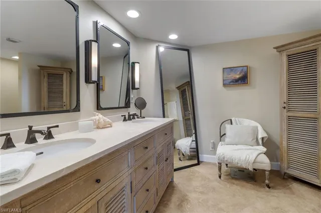 a bathroom with a sink double vanity and a mirror
