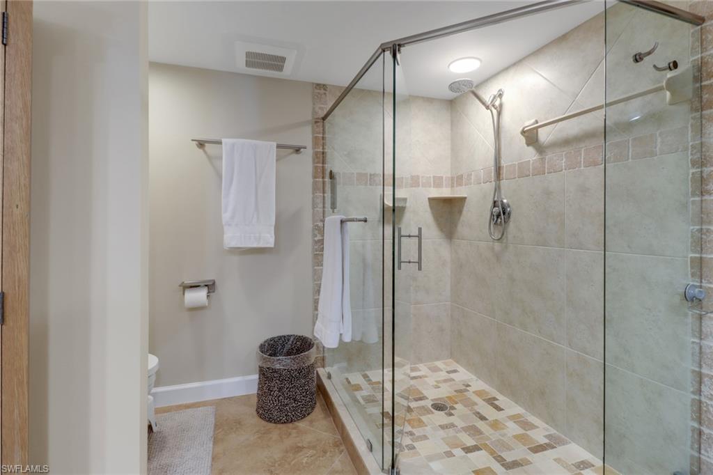 25 Bluebill Avenue, Unit A906 Naples, FL 34108 - Photo 23 of 40 a bathroom with a shower
