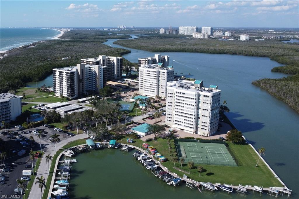 25 Bluebill Avenue, Unit A906 Naples, FL 34108 - Photo 3 of 40 a view of a city and ocean view