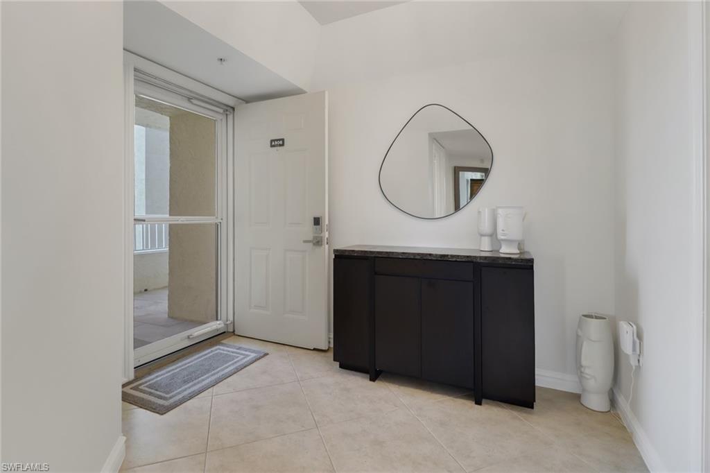 25 Bluebill Avenue, Unit A906 Naples, FL 34108 - Photo 31 of 40 a bathroom with a mirror and a shower