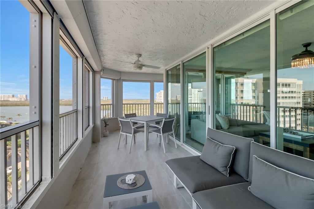 25 Bluebill Avenue, Unit A906 Naples, FL 34108 - Photo 32 of 40 a view of a dining room with furniture window and outside view