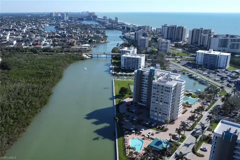 an aerial view of a house with a ocean view