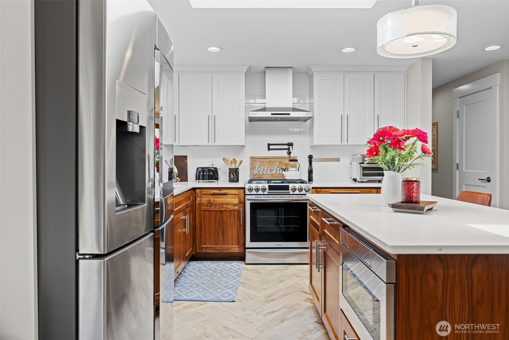 106 234th Place Southeast Bothell, WA 98021 - Photo 12 of 38 a kitchen with stainless steel appliances granite countertop a sink refrigerator and cabinets