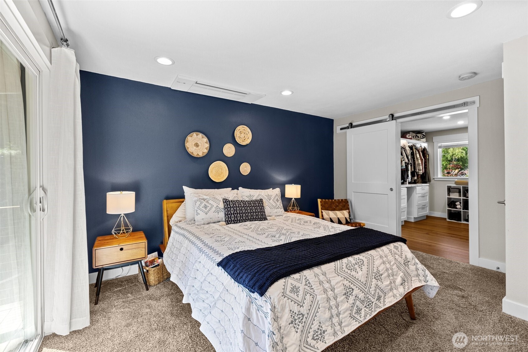 106 234th Place Southeast Bothell, WA 98021 - Photo 16 of 38 a bedroom with a bed and a lamp with the bathroom