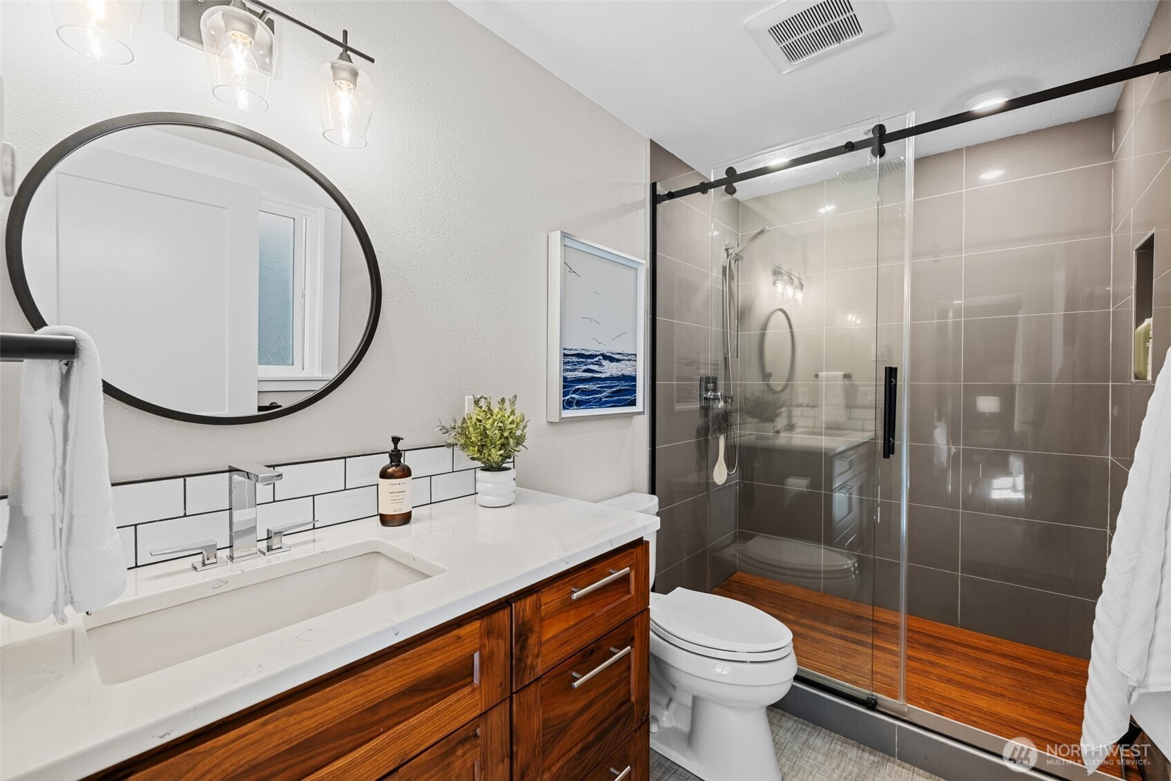 106 234th Place Southeast Bothell, WA 98021 - Photo 18 of 38 a bathroom with a sink a toilet and a mirror