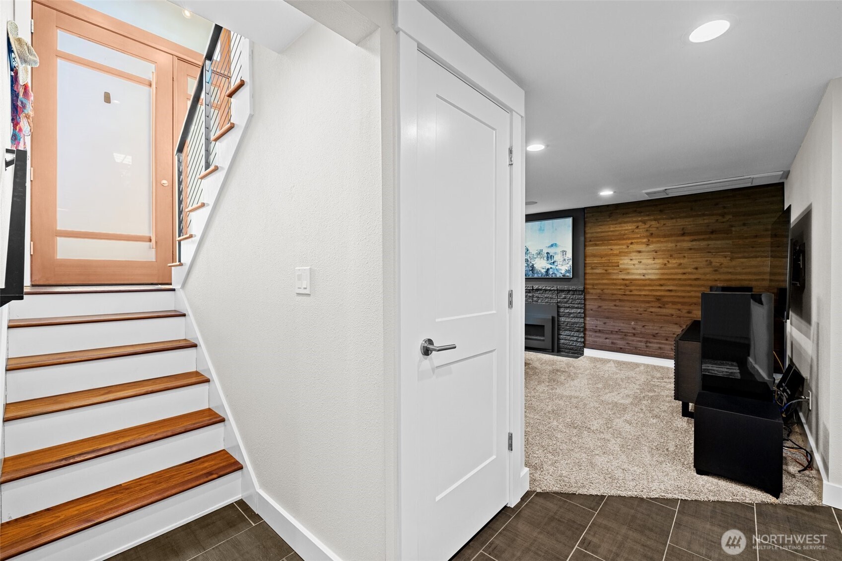 106 234th Place Southeast Bothell, WA 98021 - Photo 22 of 38 a view of a hallway with wooden floor and staircase