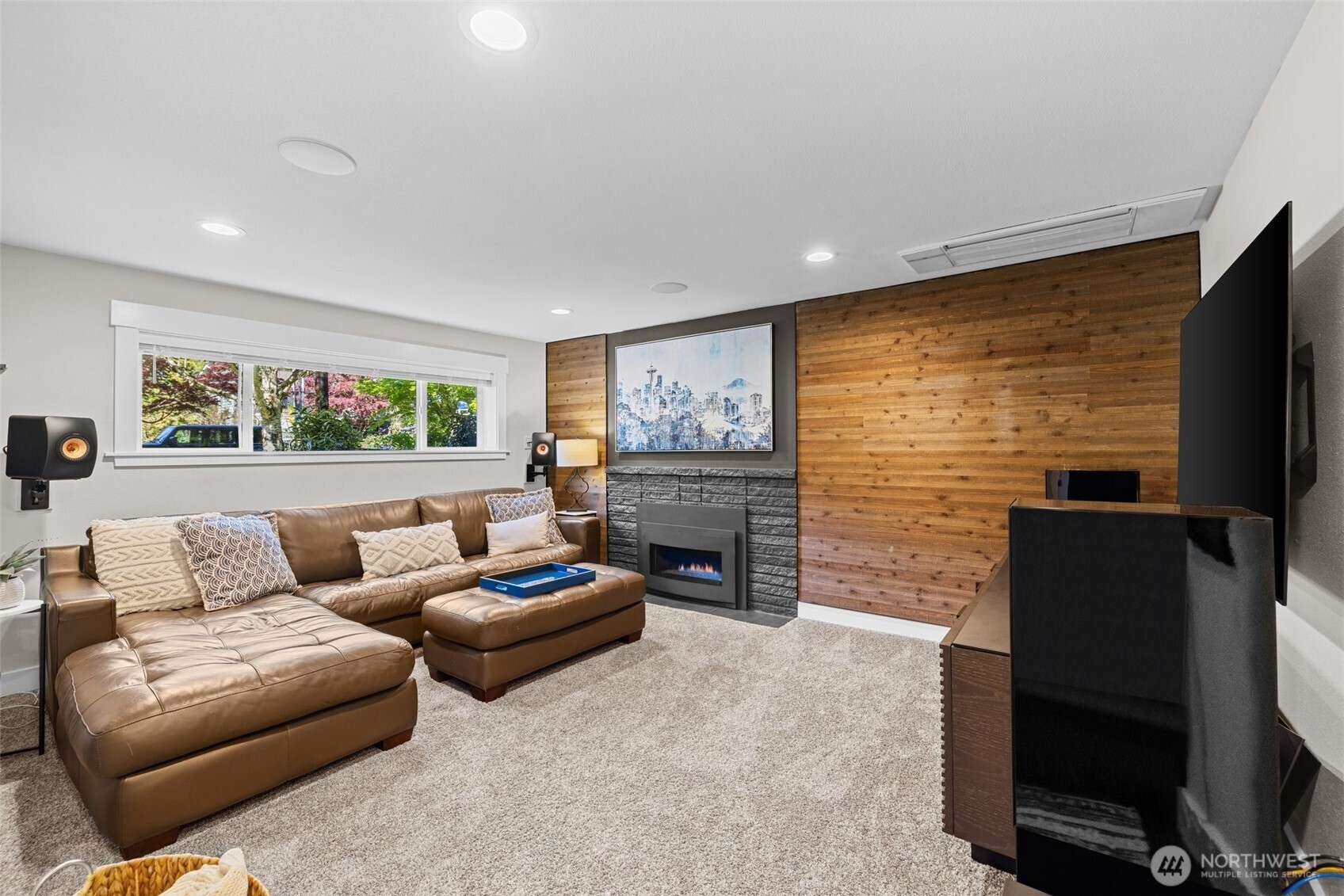 106 234th Place Southeast Bothell, WA 98021 - Photo 23 of 38 a living room with fireplace furniture and a flat screen tv