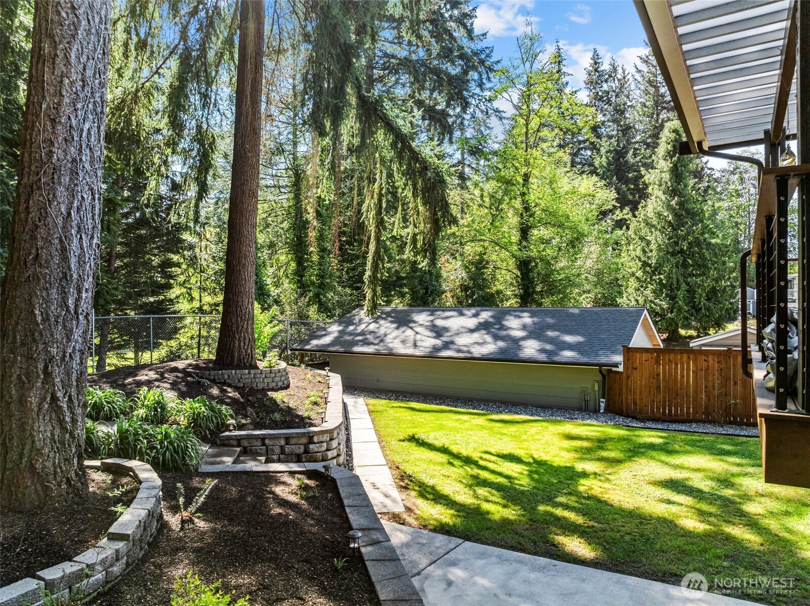 106 234th Place Southeast Bothell, WA 98021 - Photo 29 of 38 a view of a backyard with plants and outdoor seating