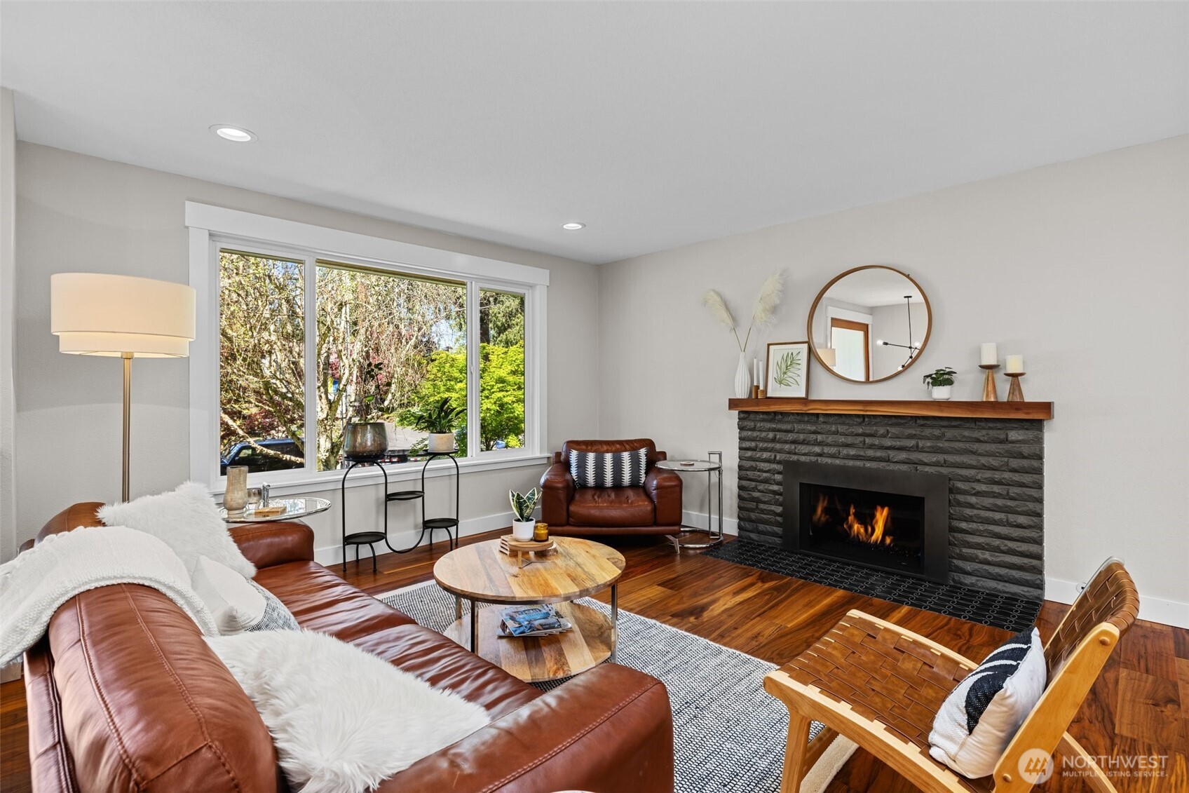106 234th Place Southeast Bothell, WA 98021 - Photo 6 of 38 a living room with furniture fireplace and window