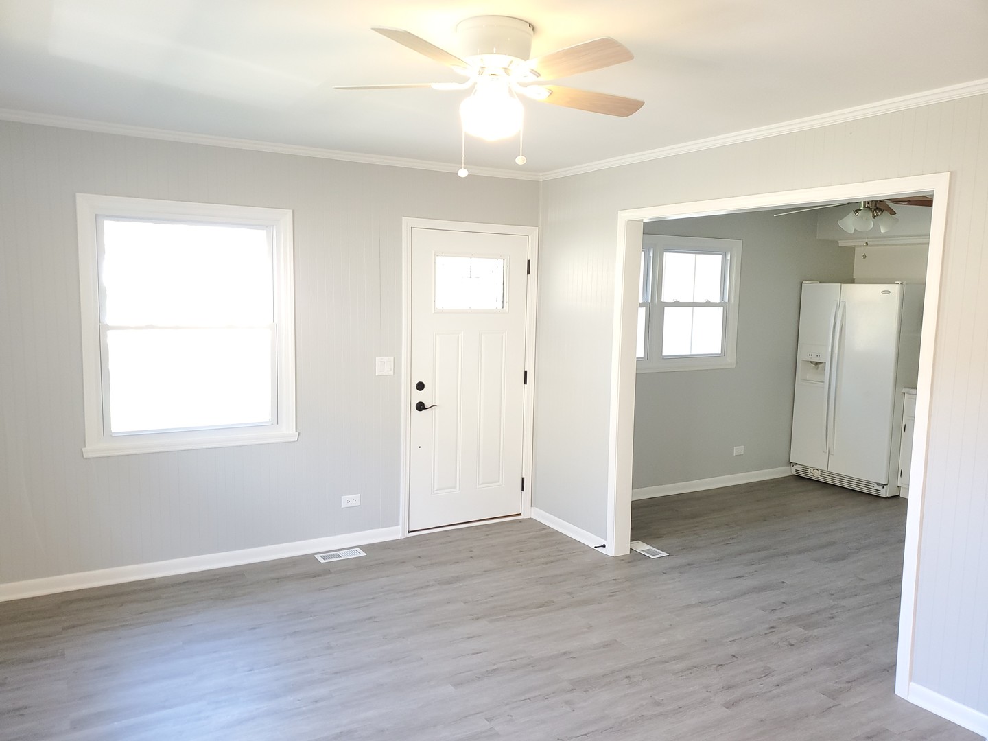 26W269 Jewell Road Winfield, IL 60190 - Photo 9 of 23 wooden floor in an empty room with a window