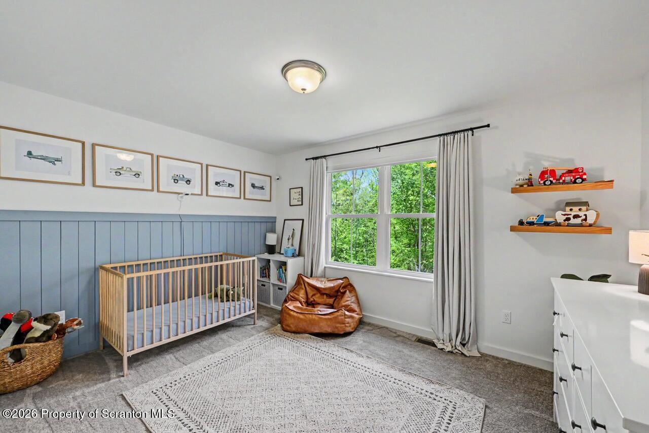 100 Highland Road Moscow, PA 18444 - Photo 61 of 85 a bedroom with a bed and a window