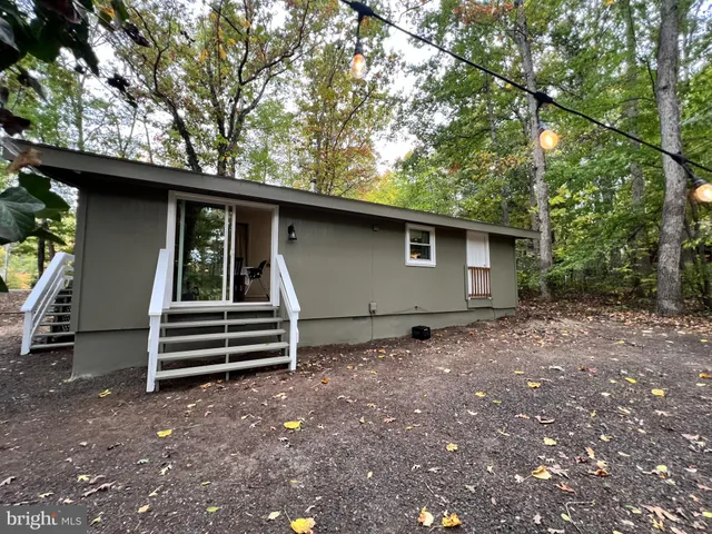 a view of backyard with green space