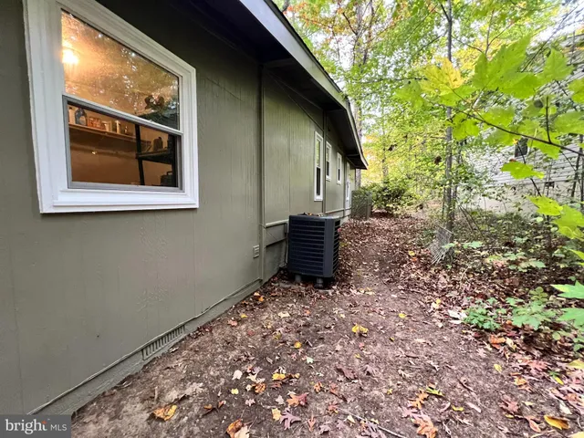 a view of an outdoor space with trees in the background