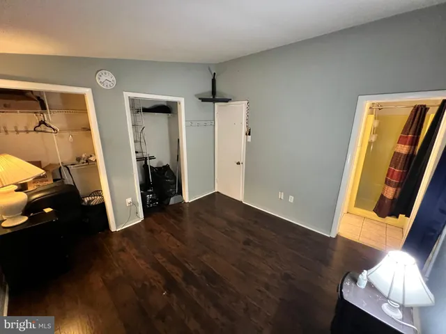 a bedroom with a bed and a mirror