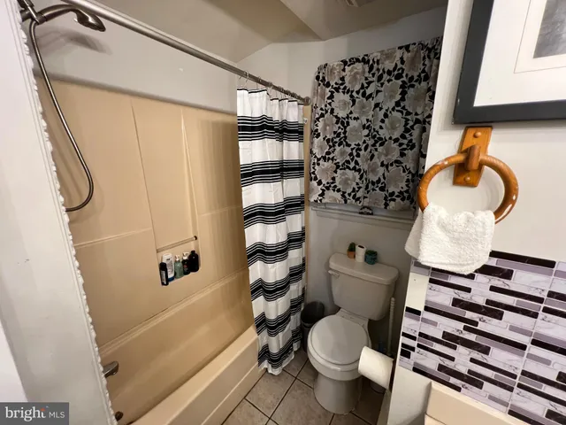 a view of a street and trees beside of road