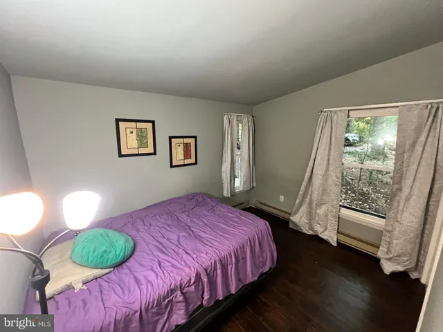 a view of a street with a tree in the background