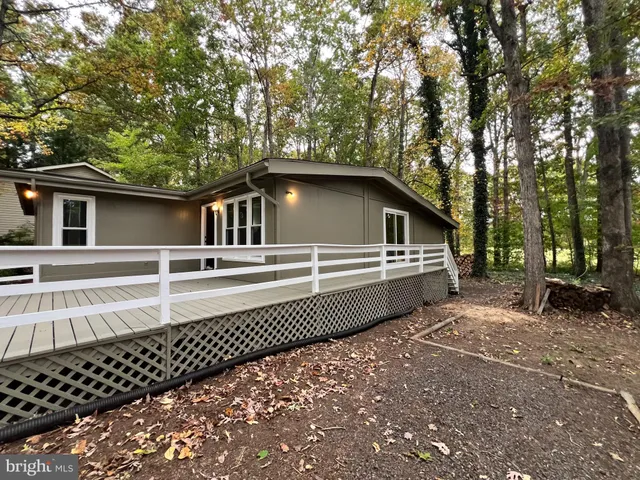 a view of outdoor space with deck and tree