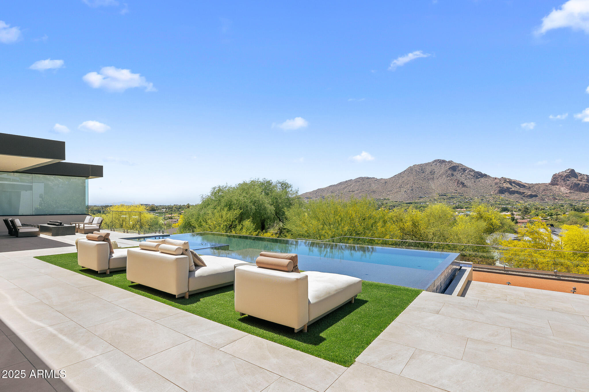 6149 East Indian Bend Road Paradise Valley, AZ 85253 - Photo 35 of 77 a view of a patio with couches and a flat tv screen