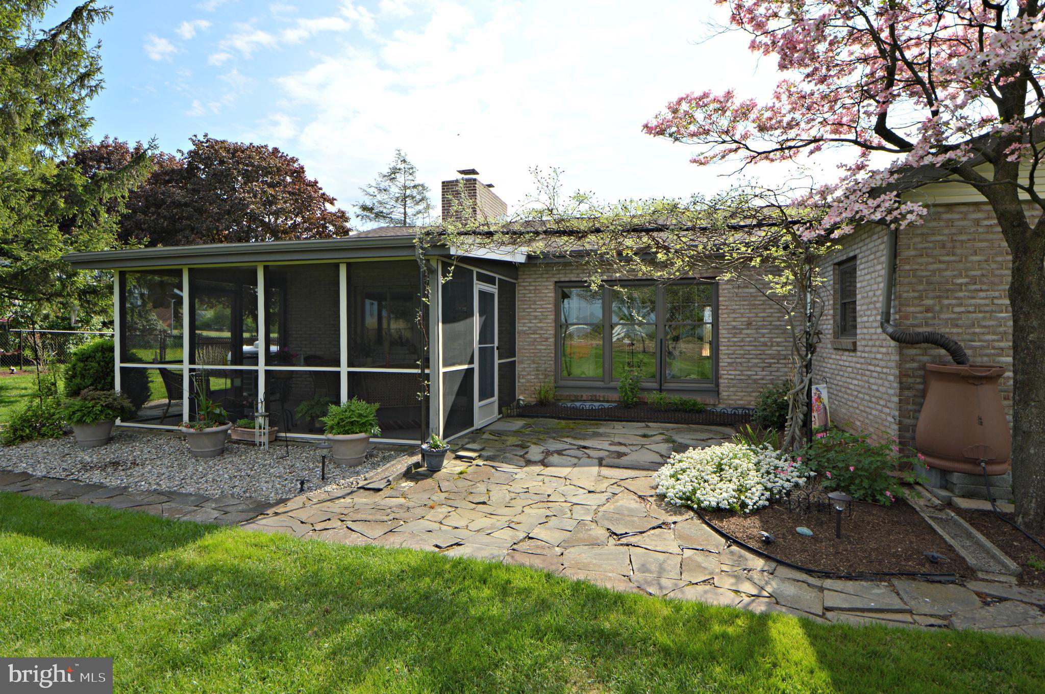 49 Oberholtzer Road Elizabethtown, PA 17022 - Photo 30 of 36 Patio & Screened Porch --- lovely flowers & tree
