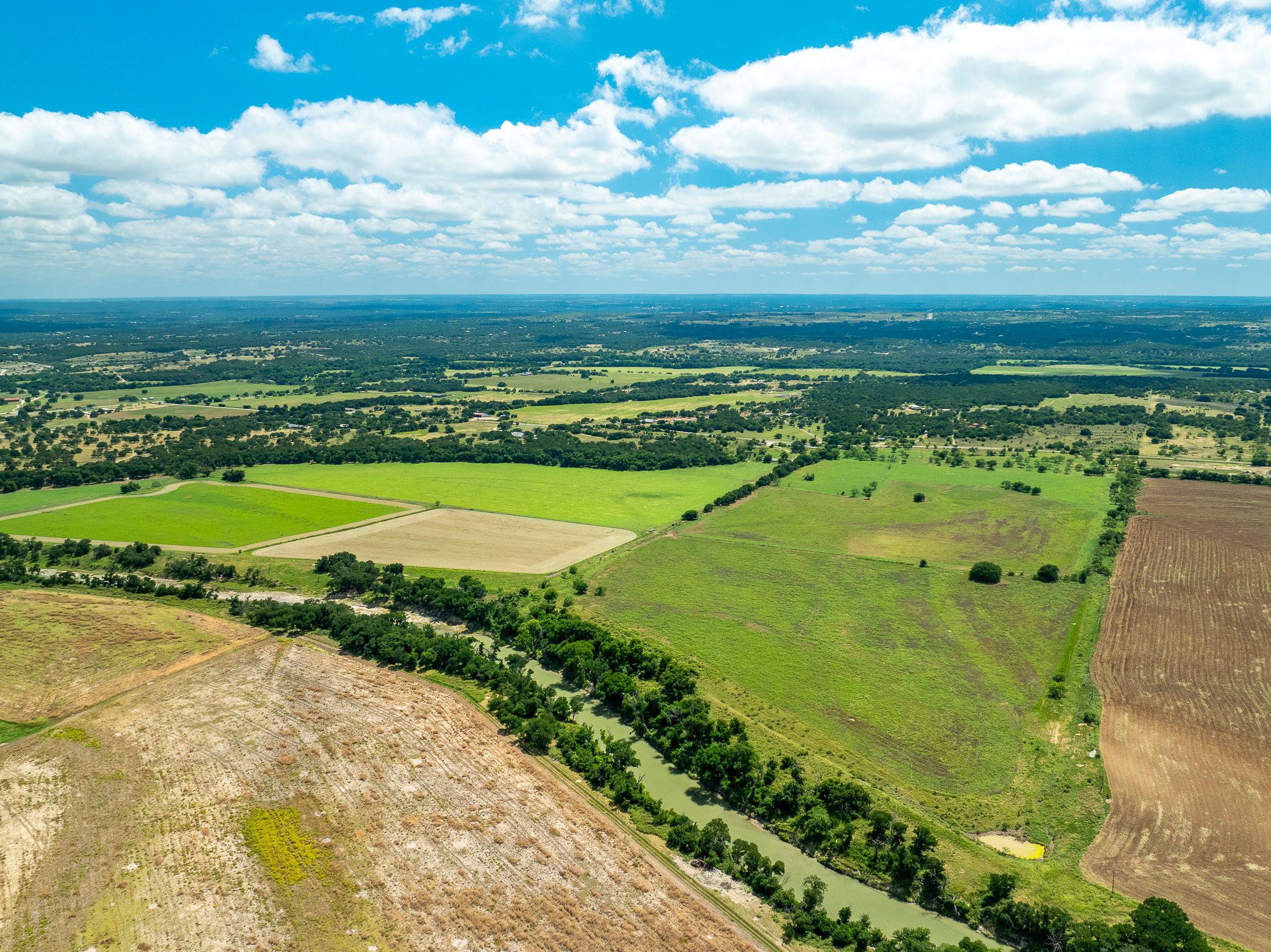 8044 580th Street East Kempner, TX 76539 - Photo 6 of 40 Rolling countryside views with lush fields and a winding waterway.