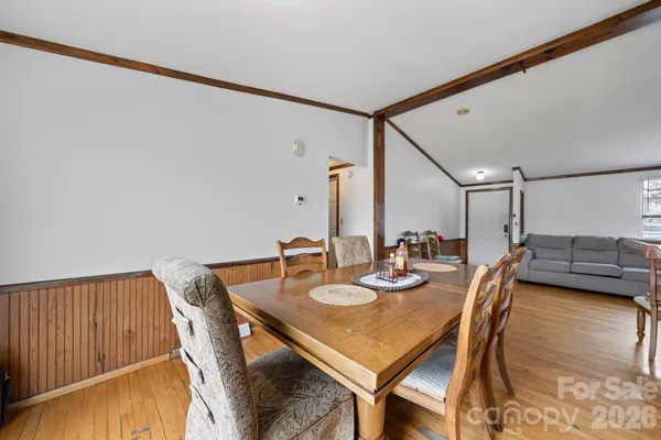 a bed room with furniture and a wooden floor