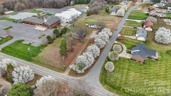 a view of a swimming pool with a yard