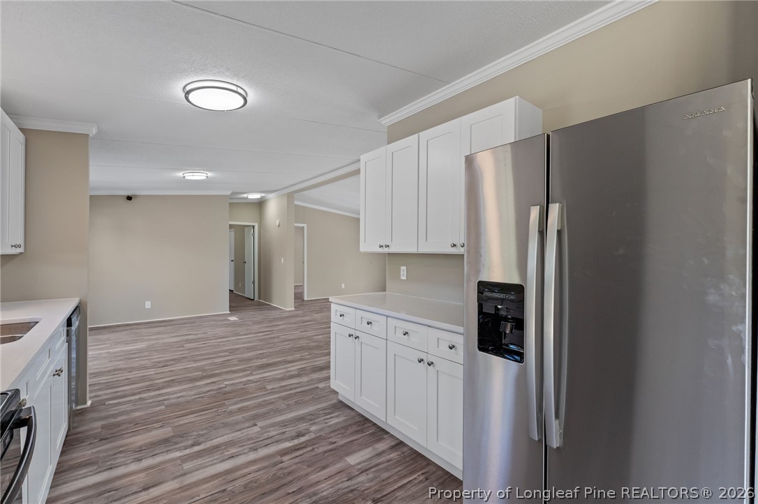515 Mt Zion Road Red Springs, NC 28377 - Photo 10 of 50 a kitchen with stainless steel appliances a refrigerator and a stove top oven