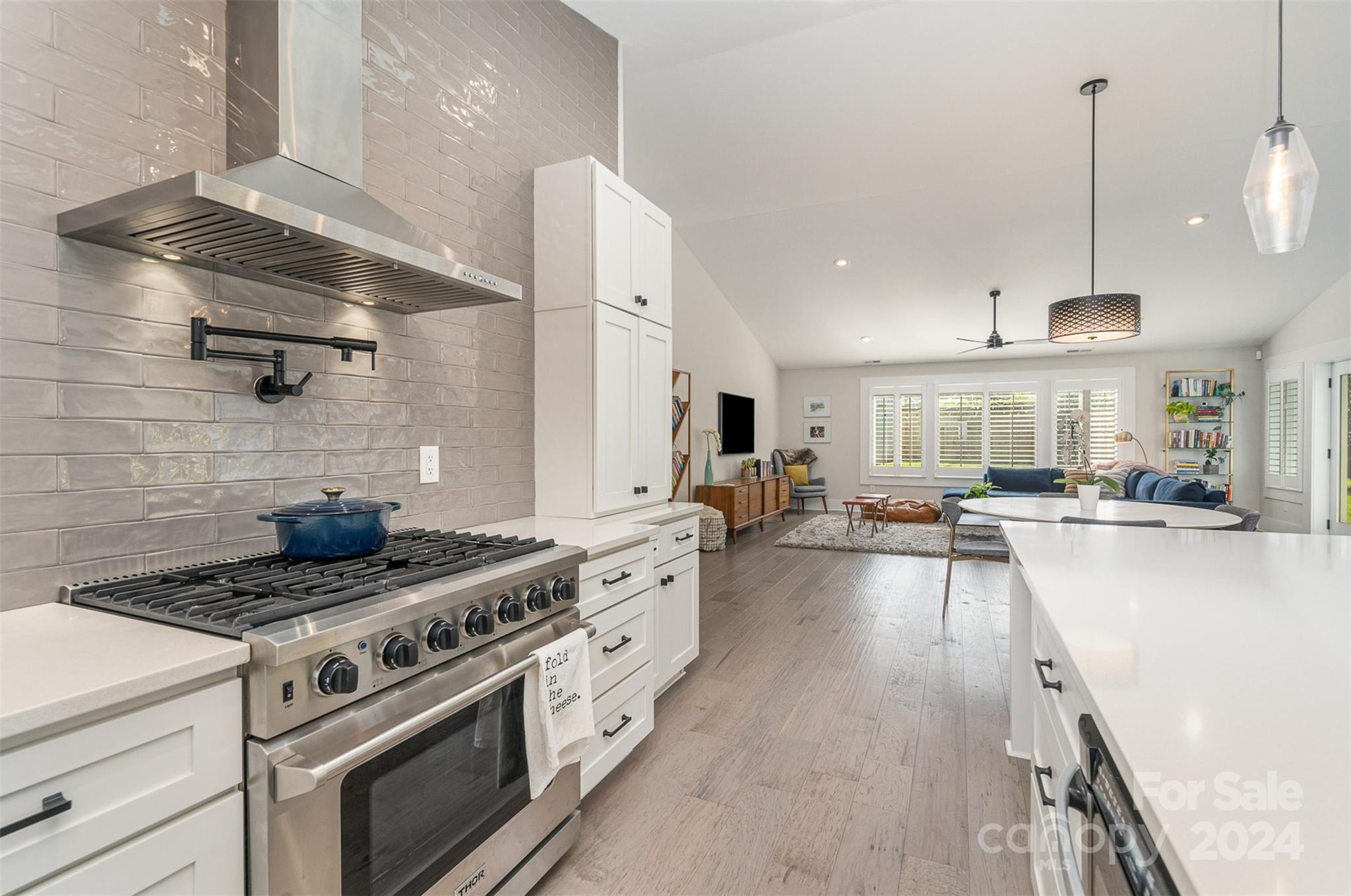 5335 Valley Forge Road Charlotte, NC 28210 - Photo 11 of 29 a kitchen with stove and a wooden floor
