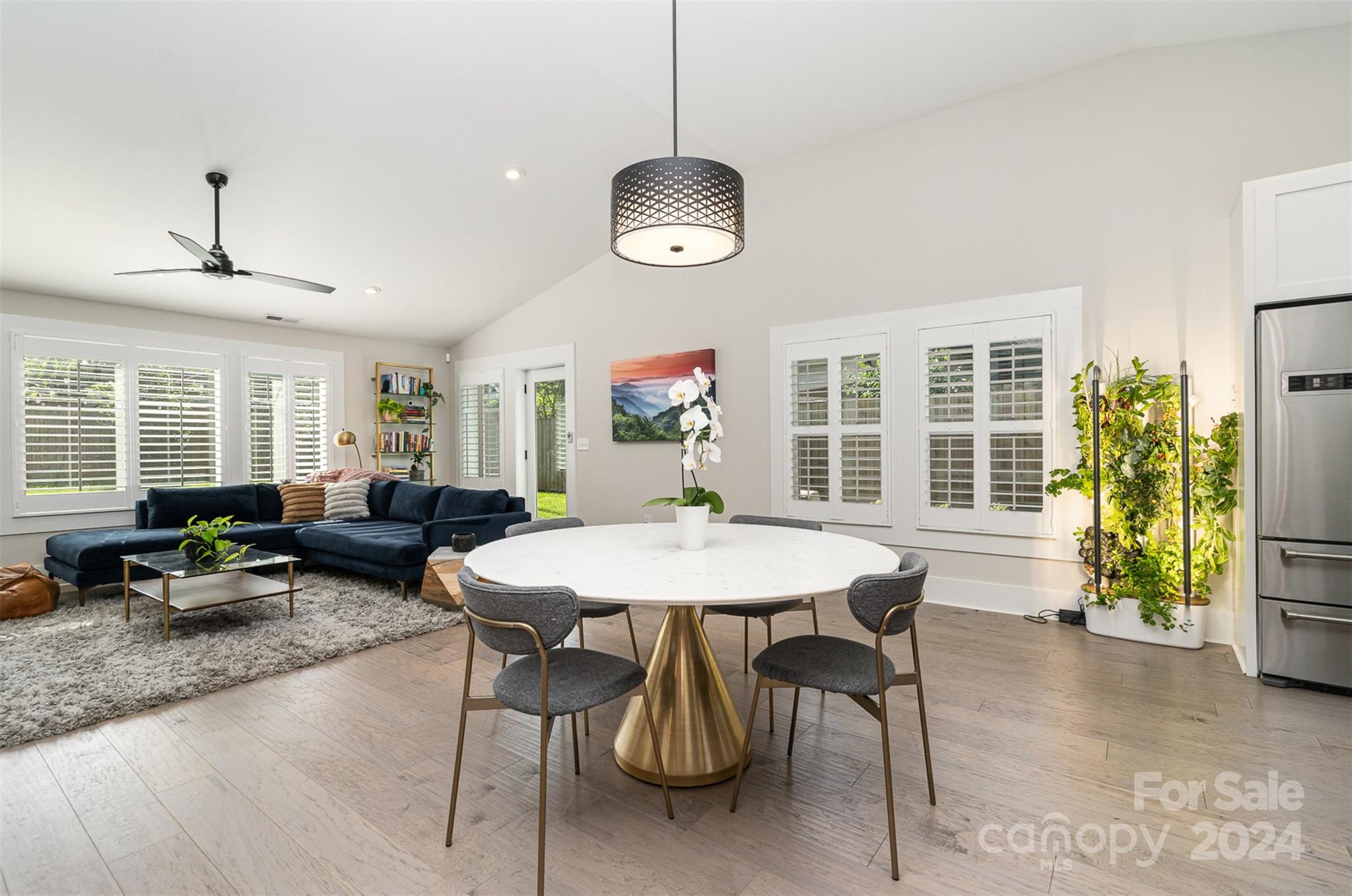 5335 Valley Forge Road Charlotte, NC 28210 - Photo 12 of 29 a living room with furniture a window and gym equipment