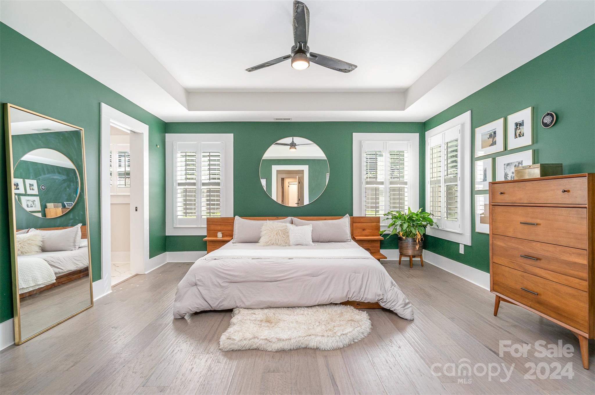 5335 Valley Forge Road Charlotte, NC 28210 - Photo 15 of 29 a bedroom with a large bed and a dresser