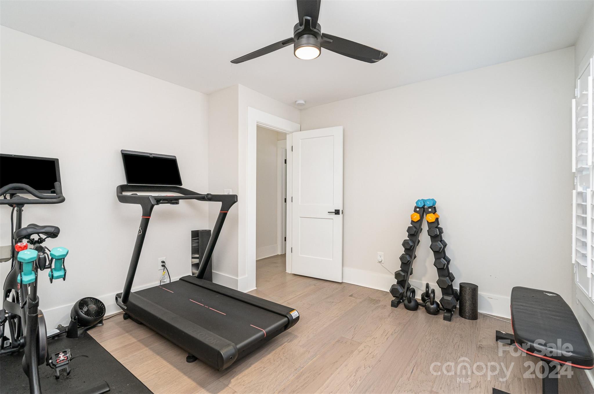 5335 Valley Forge Road Charlotte, NC 28210 - Photo 22 of 29 a room with gym equipment and a flat screen tv