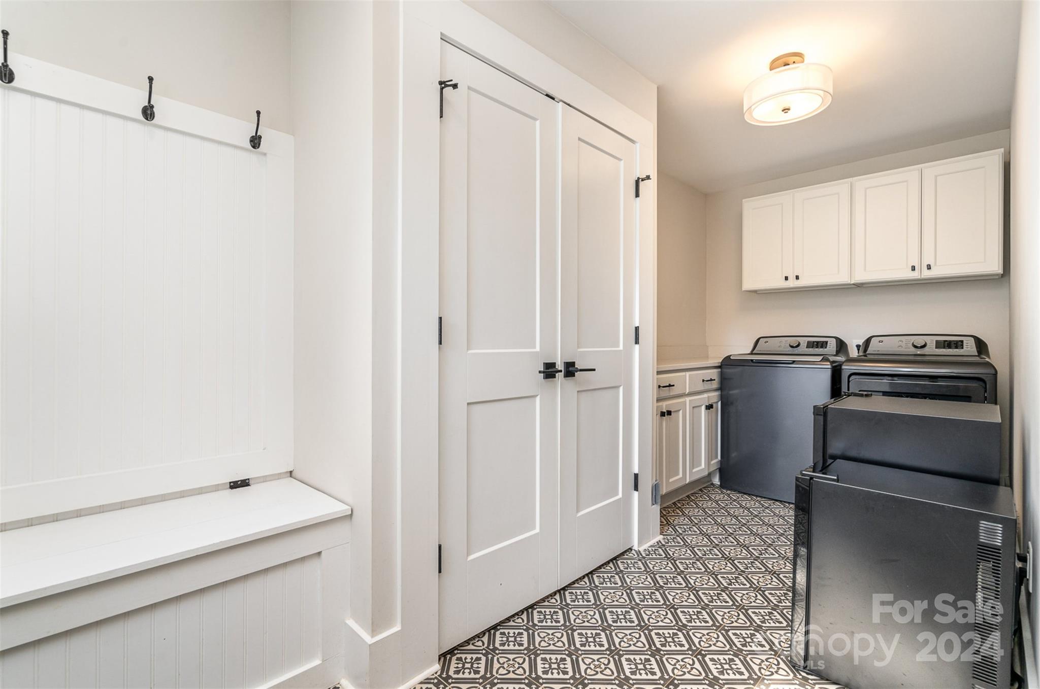 5335 Valley Forge Road Charlotte, NC 28210 - Photo 24 of 29 a kitchen with a refrigerator and white cabinets