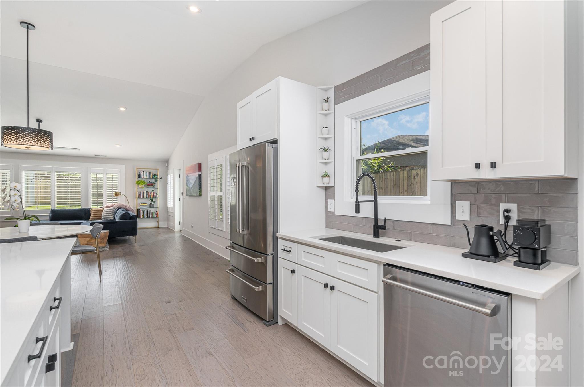 5335 Valley Forge Road Charlotte, NC 28210 - Photo 10 of 29 a kitchen with refrigerator and window